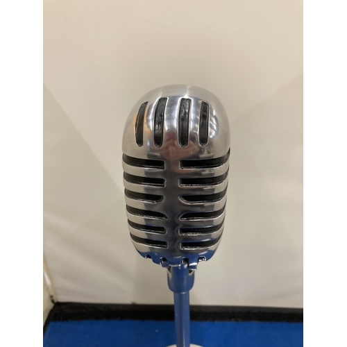 27 - A CHROME MICROPHONE ON A STAND