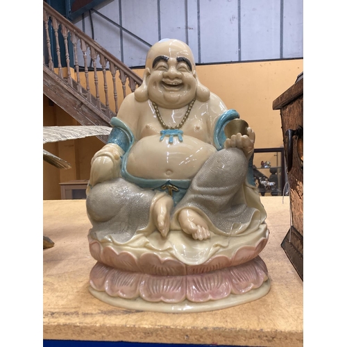 74 - A LARGE POLISHED RESIN LAUGHING BUDDAH 16