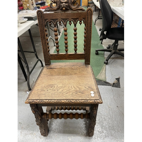 84A - A CARVED OAK HALL CHAIR