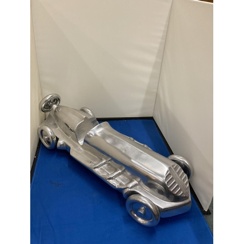 99 - A LARGE CHROME ART DECO RACING CAR, LENGTH APPROX 55CM