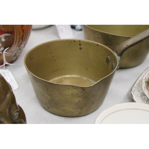 209 - THREE GRADUATED BRASS PANS