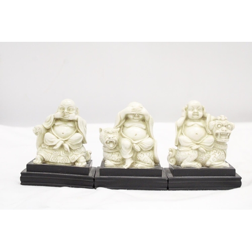 212 - A SET OF BUDDAH FIGURES ON WOODEN PLINTHS - SEE, HEAR AND SPEAK NO EVIL