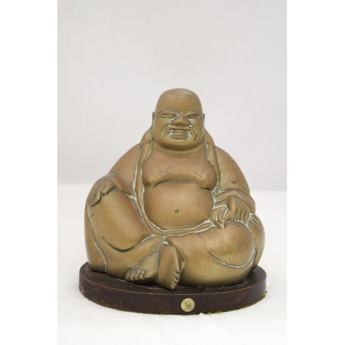 227 - A BRASS BUDDHA ON STAND