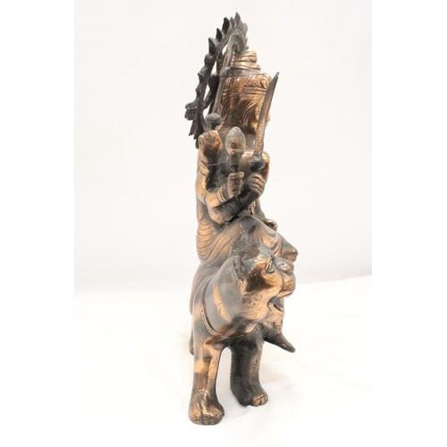 260 - A BRONZE COLOURED, EXOTIC INDIAN MOTHER GODDESS ON A TIGER'S BACK, HEIGHT 38CM, LENGTH 28CM