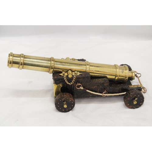 278 - A LARGE HEAVY BRASS CANON, HEIGHT 14CM, LENGTH 35CM