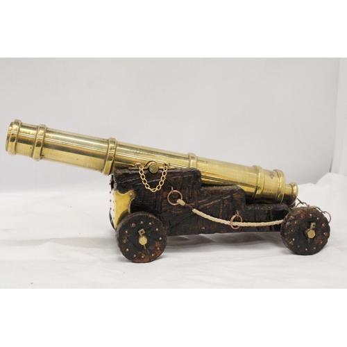 278 - A LARGE HEAVY BRASS CANON, HEIGHT 14CM, LENGTH 35CM