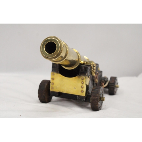 278 - A LARGE HEAVY BRASS CANON, HEIGHT 14CM, LENGTH 35CM