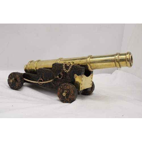 278 - A LARGE HEAVY BRASS CANON, HEIGHT 14CM, LENGTH 35CM