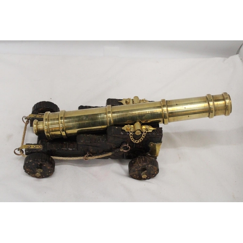 278 - A LARGE HEAVY BRASS CANON, HEIGHT 14CM, LENGTH 35CM