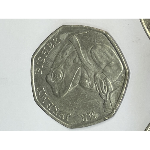 596 - THREE 2017 COLLECTABLE 50 PENCE PIECES TO INCLUDE TWO PETER RABBIT AND ONE JEREMY FISHER