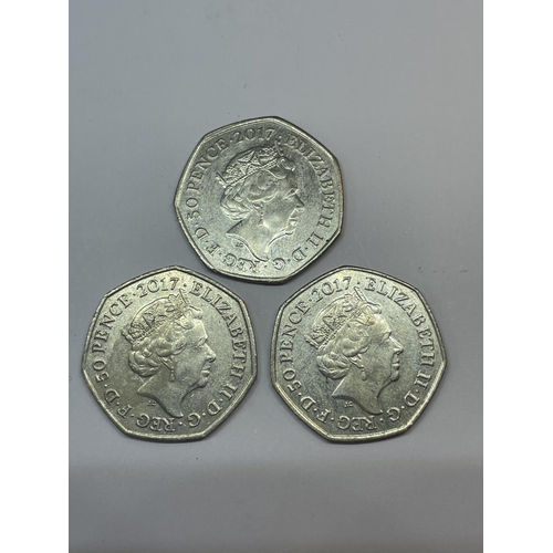 596 - THREE 2017 COLLECTABLE 50 PENCE PIECES TO INCLUDE TWO PETER RABBIT AND ONE JEREMY FISHER