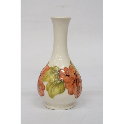 730 - A MOORCROFT HIBISCUS ON CREAM VASE