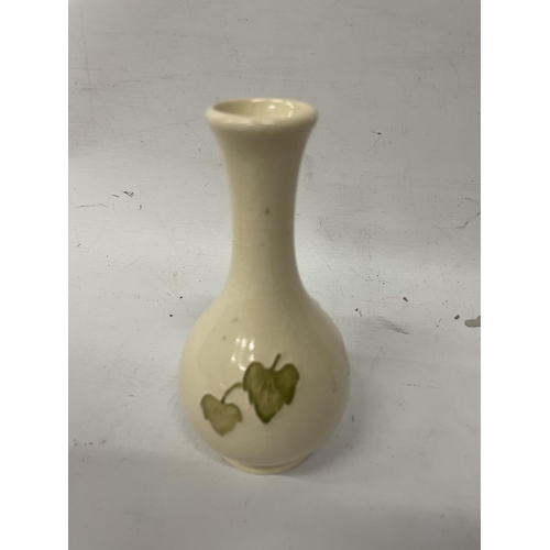 730A - A MOORCROFT CAMPANULA VASE WITH A CREAM BACKGROUND