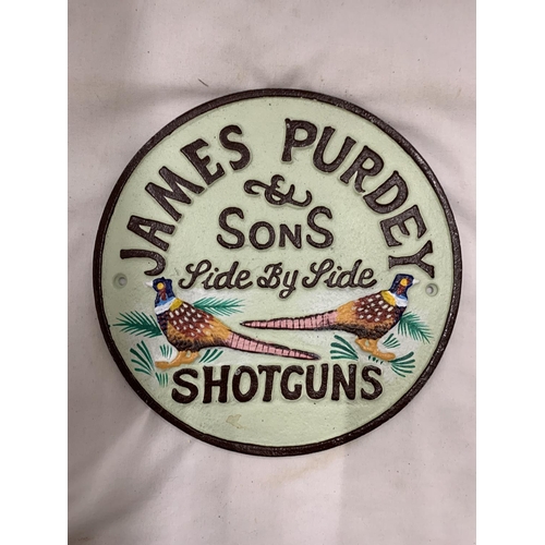 987 - A CAST 'JAMES PURDEY SHOTGUNS' SIGN, DIAMETER, 22CM