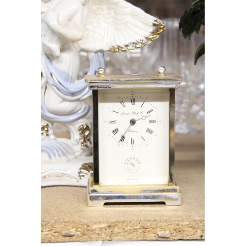 1072 - TWO MANTLE CLOCKS TO INCLUDE A CERAMIC ANGEL WITH CHILDREN, PLUS A CARRIAGE CLOCK