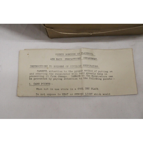 1115 - A VINTAGE BOXED GAS MASK PLUS INSTRUCTIONS, FROM THE COUNTY BOROUGH OF BLACKPOOL