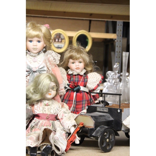 1182 - SIX VINTAGE DOLLS WITH STANDS PLUS A WOODEN TRUCK