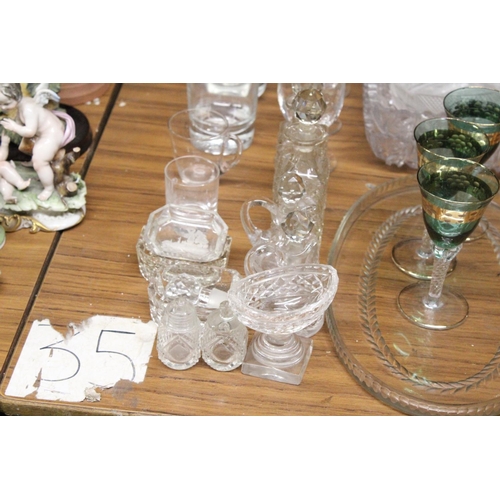 1259 - A LARGE MIXED LOT OF GLASSWARE TO INCLUDE THREE GLASS TRAYS, FOUR OIL DECANTERS, COCKTAIL GLASSES, S... 