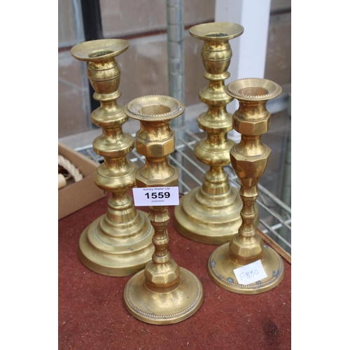 1559 - TWO PAIRS OF VINTAGE BRASS CANDLE STICKS