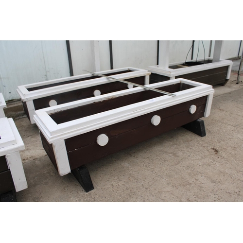 1616 - A PAIR OF LARGE WOODEN PAINTED TROUGH PLANTERS