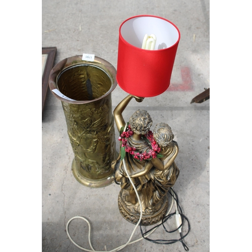 1791 - A DECORATIVE GREEK GOD TABLE LAMP AND A BRASS STICK STAND