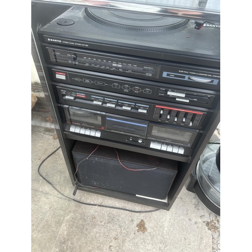 2362 - A CABINET CONTAINING A SANYO STEREO SYSTEM WITH TWO SPEAKERS