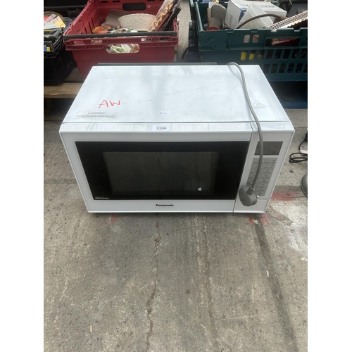 2390 - A WHITE PANASONIC MICROWAVE OVEN