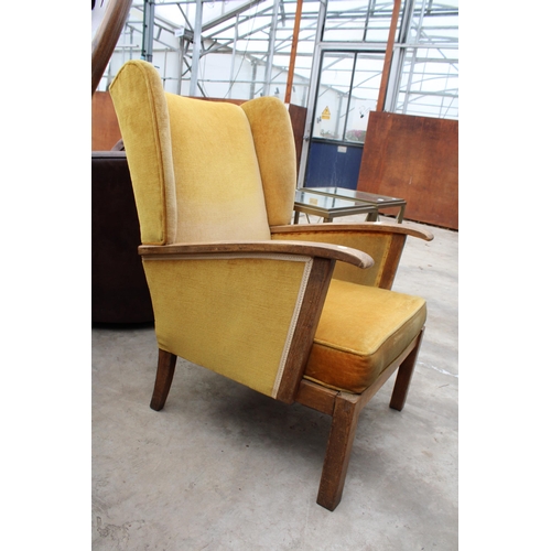 2531 - AN ART DECO STYLE WINGED FIRESIDE CHAIR, BEARING BE-AT-LES FURNITURE LABEL, BRISTOW AND TOWNSEND, HI... 