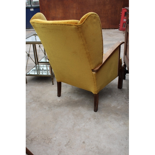 2531 - AN ART DECO STYLE WINGED FIRESIDE CHAIR, BEARING BE-AT-LES FURNITURE LABEL, BRISTOW AND TOWNSEND, HI... 