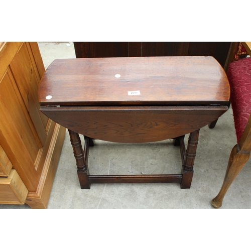 2557 - A MINIATURE OAK DROP-LEAF TABLE ON TURNED LEGS