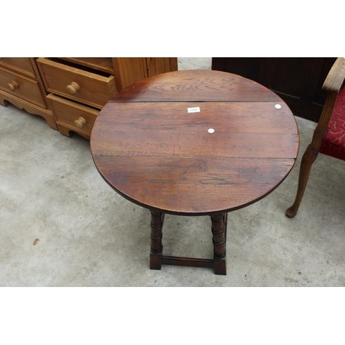 2557 - A MINIATURE OAK DROP-LEAF TABLE ON TURNED LEGS