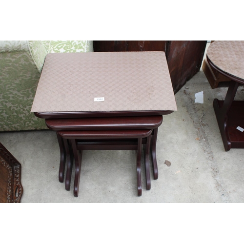 2564 - A MAHOGANY NEST OF THREE TABLES