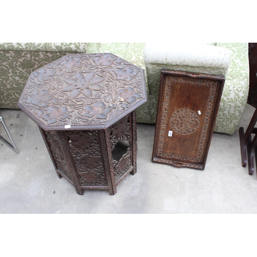 2565 - AN OCTAGONAL VICTORIAN CARVED HARDWOOD OCCASIONAL TABLE DECORATED WITH VINE LEAVES ON FOLDING BASE A... 