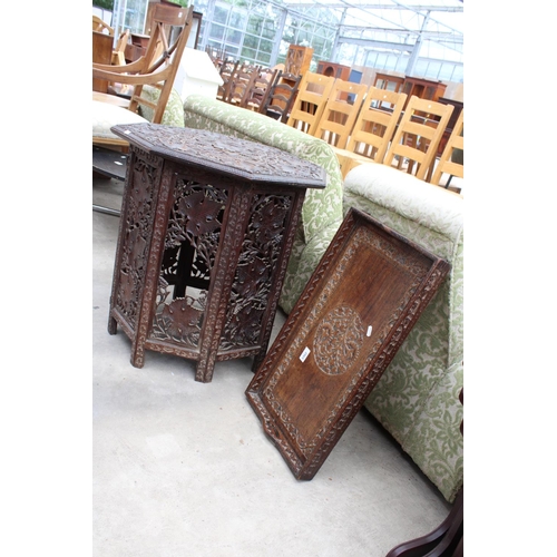 2565 - AN OCTAGONAL VICTORIAN CARVED HARDWOOD OCCASIONAL TABLE DECORATED WITH VINE LEAVES ON FOLDING BASE A... 