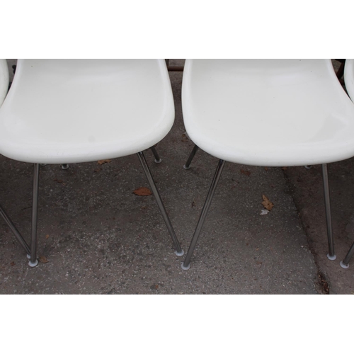 2572 - A SET OF SIX CHARLES EAMES FIBREGLASS CHAIRS ON CHROME LEGS BY VITRA AND AN R.E.L. SINGLE CHAIR