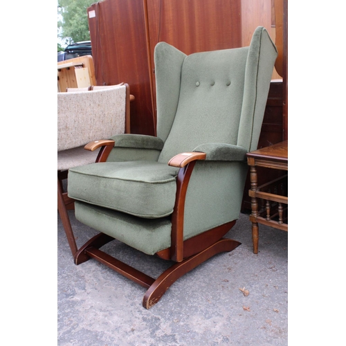 2575 - AN UPHOLSTERED WINGED ROCKING CHAIR