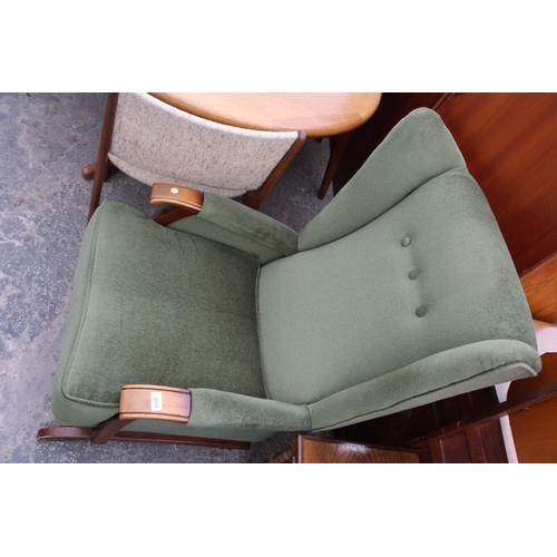 2575 - AN UPHOLSTERED WINGED ROCKING CHAIR