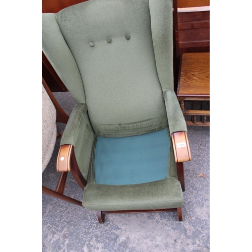 2575 - AN UPHOLSTERED WINGED ROCKING CHAIR