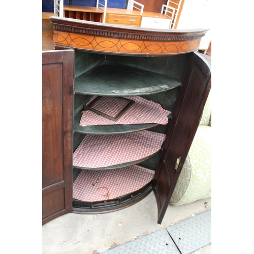 2590 - A GEORGE III MAHOGANY INLAID AND CROSSBANDED TWO DOOR CORNER CUPBOARD, 32