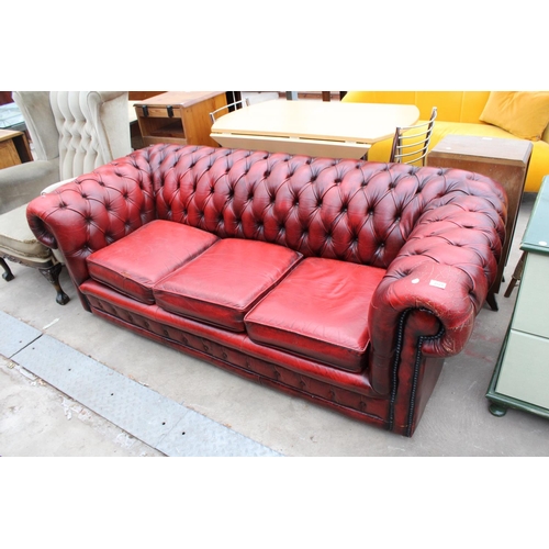 2629 - AN OXBLOOD LEATHER THREE SEATER CHESTERFIELD SETTEE