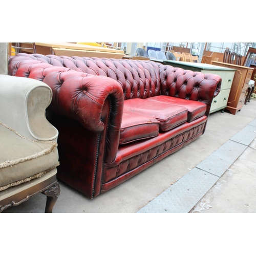 2629 - AN OXBLOOD LEATHER THREE SEATER CHESTERFIELD SETTEE