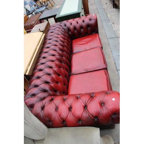 2629 - AN OXBLOOD LEATHER THREE SEATER CHESTERFIELD SETTEE