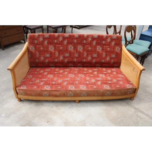 2729 - AN ERCOL ELM BERGERE SETTEE