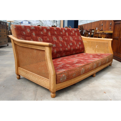 2729 - AN ERCOL ELM BERGERE SETTEE