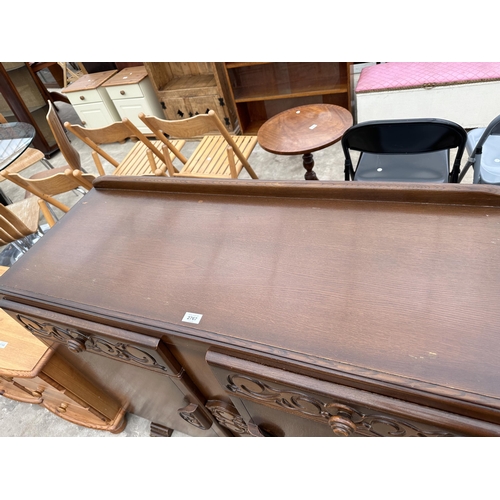 2767 - A MID 20TH CENTURY OAK SIDEBOARD ENCLOSING TWO DRAWERS AND TWO CUPBOARDS, 48