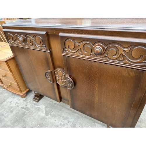 2767 - A MID 20TH CENTURY OAK SIDEBOARD ENCLOSING TWO DRAWERS AND TWO CUPBOARDS, 48