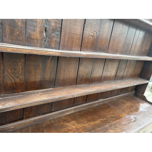 2861 - AN OAK GEORGE III DRESSER WITH THREE DRAWERS, POT BOARD AND PLATE RACK, 72