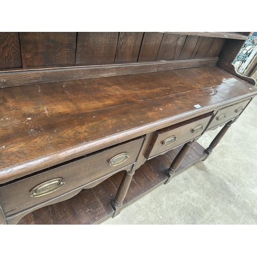 2861 - AN OAK GEORGE III DRESSER WITH THREE DRAWERS, POT BOARD AND PLATE RACK, 72