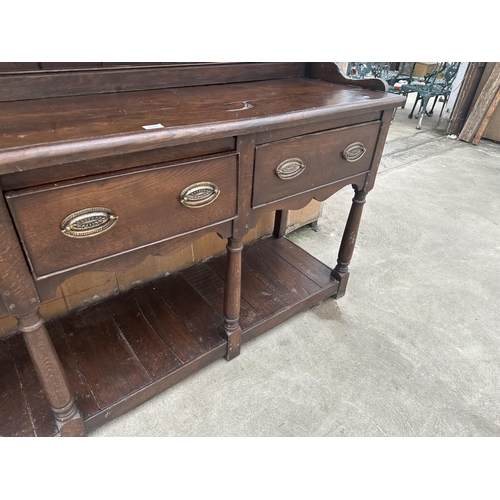 2861 - AN OAK GEORGE III DRESSER WITH THREE DRAWERS, POT BOARD AND PLATE RACK, 72