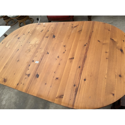 2882 - A PINE TWIN PEDESTAL DINING TABLE, 64